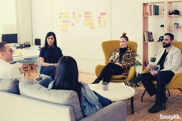 people seating on the chair having a meeting formal