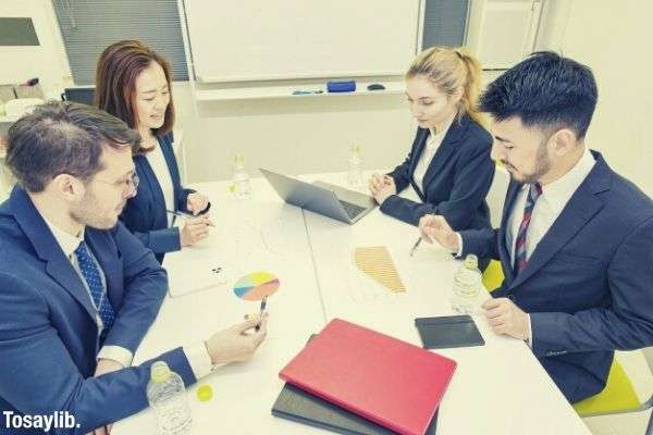 business person discuss formal meeting files documents