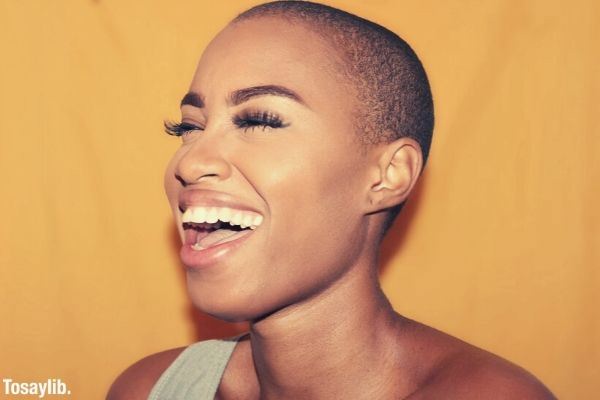 woman with short hair laughing