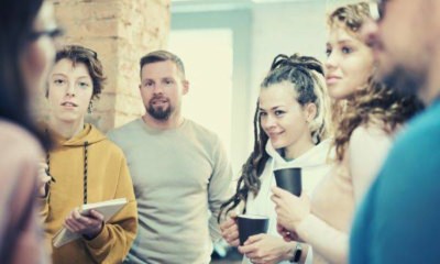 photo-of-people-standing-while-discussing