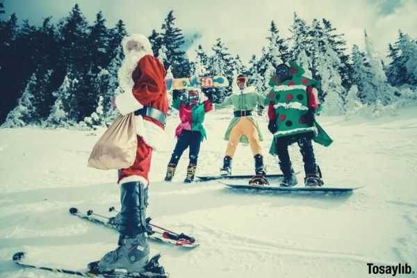 santa claus and friends riding snow board