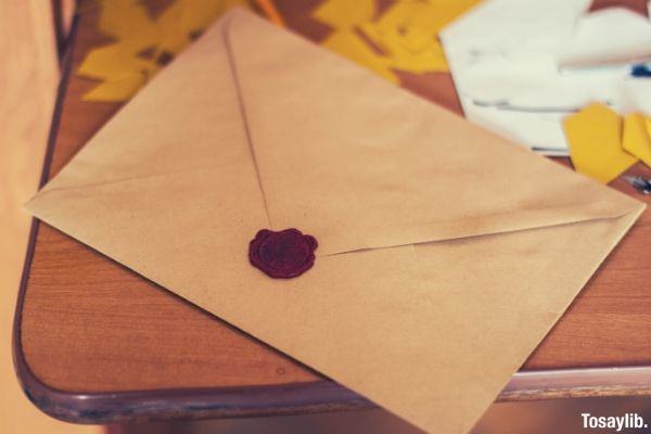 brown paper envelope with stamp on the table