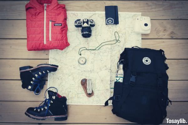 black hiking backpack fujifilm stax mini camera shoes red jacket