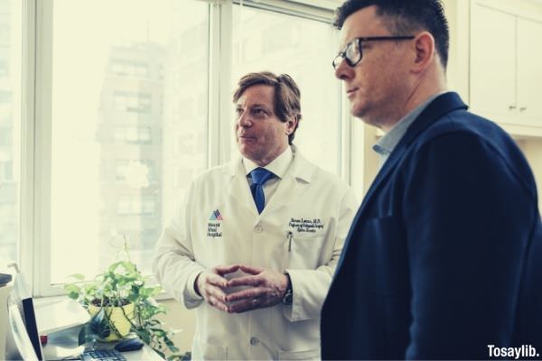 two men standing inside a room mount sinai hospital robe doctor