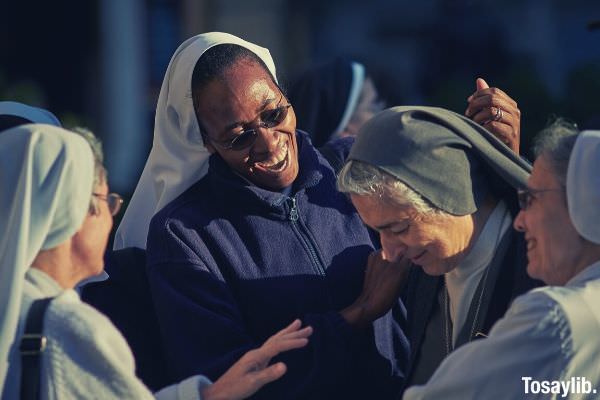 focus photo of group of nuns happy