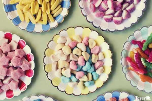 assorted candies on plate many plates different color candies