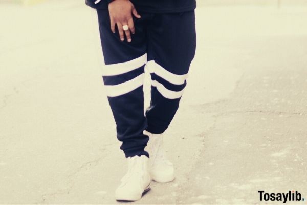 man wearing sweat pants and sneakers for casual friday