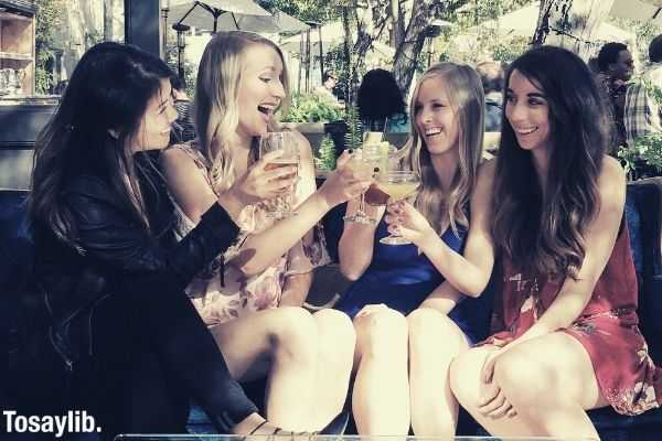 girls having drinks beverages TGIF cheers friendship