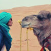 feature-woman-light-blue-turban-wednesday-camel-happy-hump-day