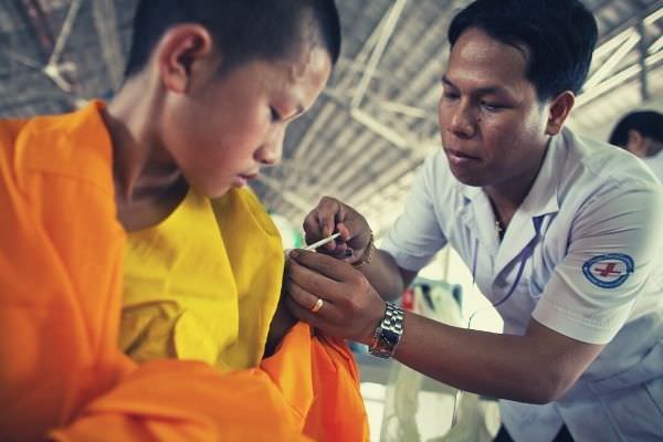 feature-boy-in-temple-dress-getting-a-vaccine-thank-you-after-surgery