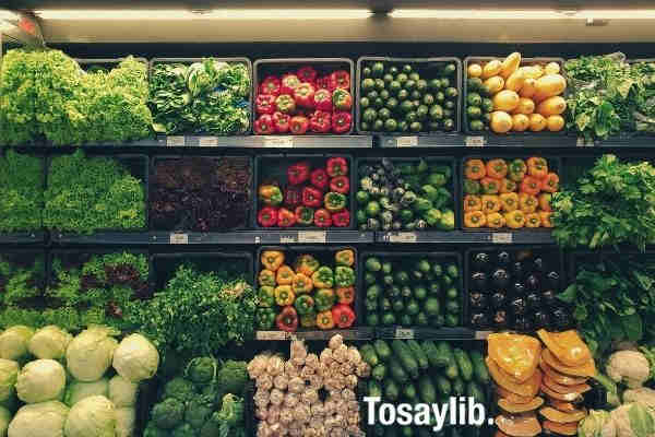 bunch of healthy green red orange vegetables at the supermarket