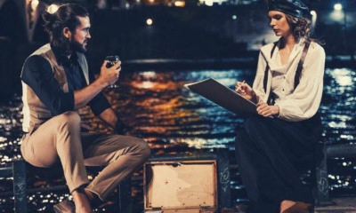 man-and-woman-respond-to-pick-up-line-sitting-on-brown-wooden-dock-during-night-time-eiffel-tower