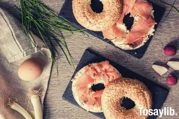 food photography bagel with salmon on top of table flatlay