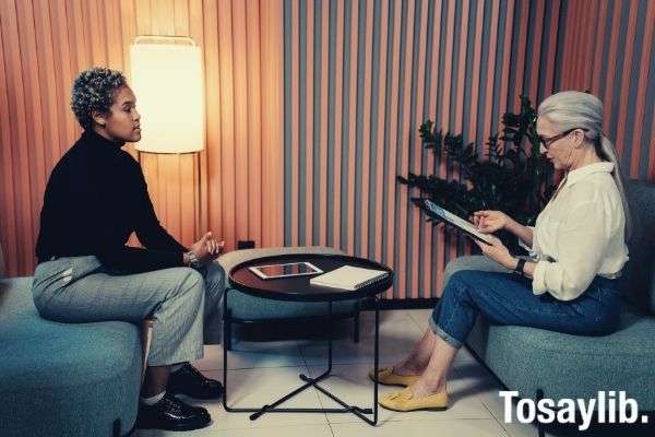 woman in black shirt and blue denim job interview