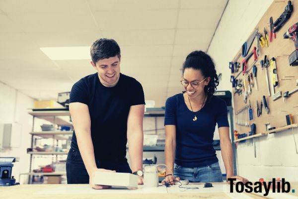 engineers in workshop man and woman