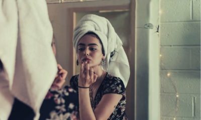 woman-putting-makeup-in-front-of-mirror-words-to-describe-lips