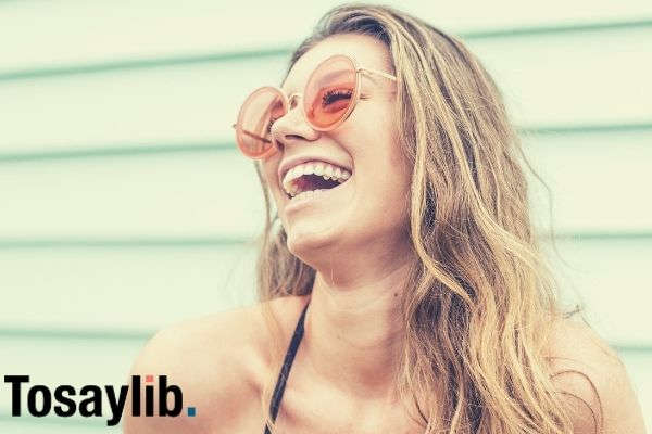 woman wearing black brassiere and sunglasses