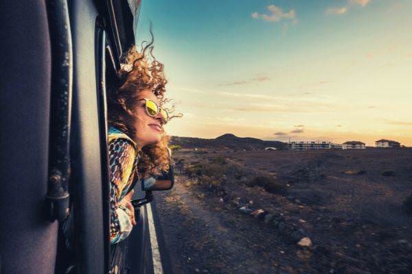 15 beautiful caucasian young woman travel outside looking outside the window