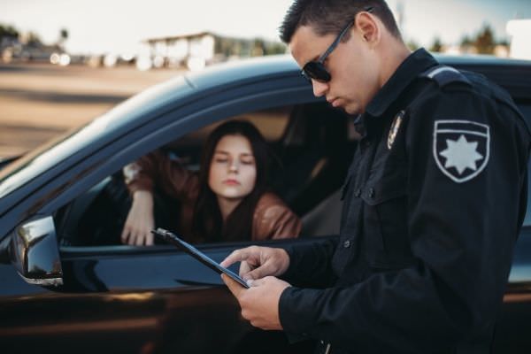 13 cop uniform checks license female driver