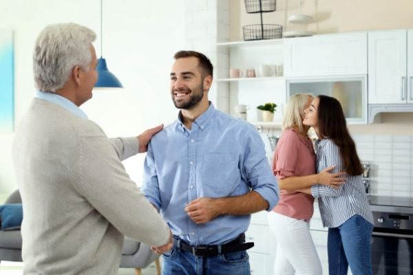 11 happy family home reunion generations shaking hands with grandfather