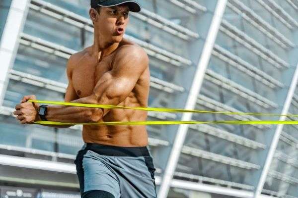 strong man working resistance band pulling photo