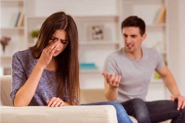 young couple quarrels among themselves home woman crying