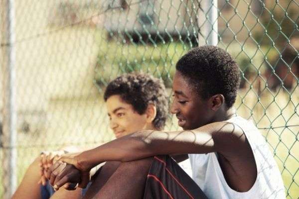 two young african boy resting outdoors