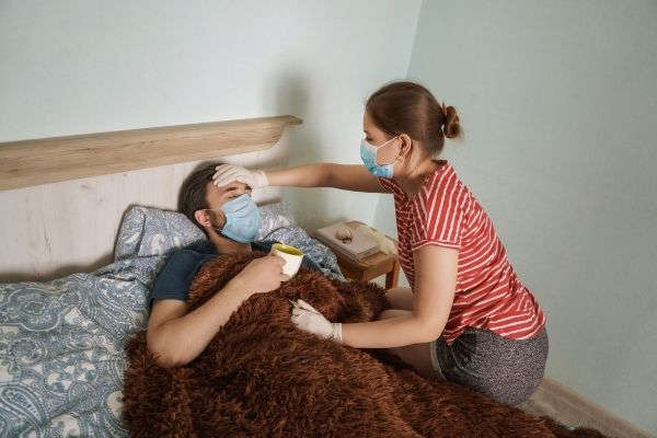 infection coronavirus couple man sick woman taking care
