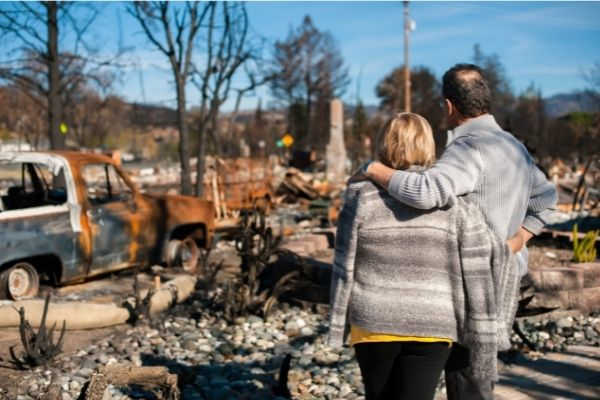 04 man and his wife owners checking burned
