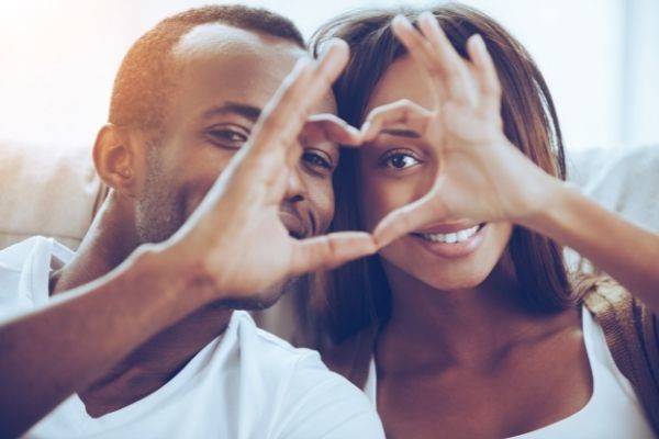 love air beautiful young african couple heart sign