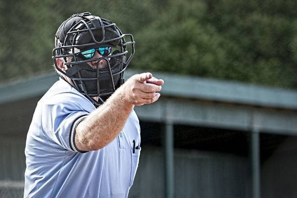umpire blue uniform calls strike baseball