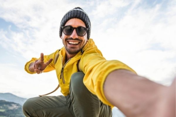 06 young hiker man taking selfie portrait