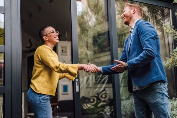 shaking hands handshake greeting good old friend woman and man