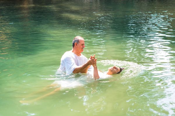 tiberiades jordan river israel man baptism