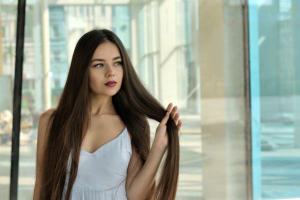 beautiful girl holding her hair on her left looking on the side 2