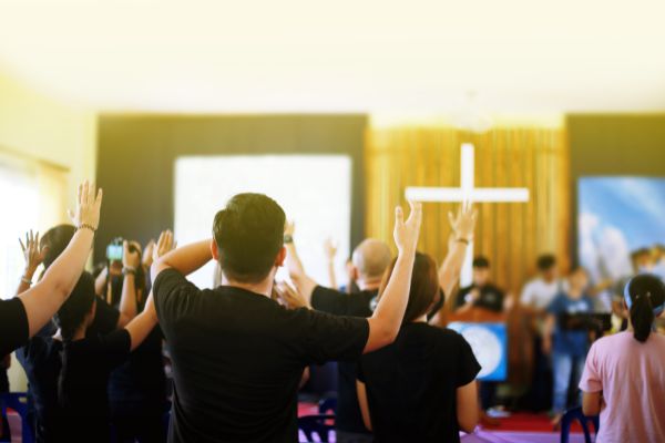 many people worship god raised hands
