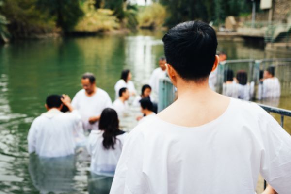 unidentified christian pilgrims during mass baptism