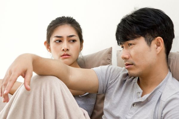 unhappy couple not talking after argument man looking away