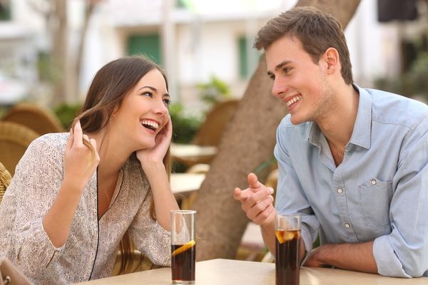 couple dating flirting while taking conversation coffee with ice