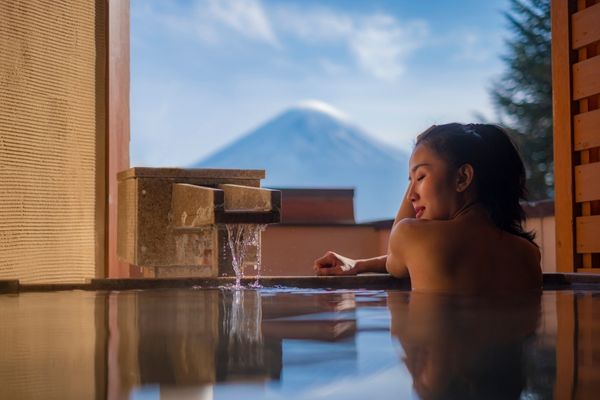beautiful woman enjoy onsen mineral hot water relax