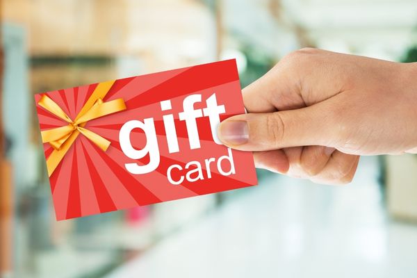 cropped image persons hand holding gift card