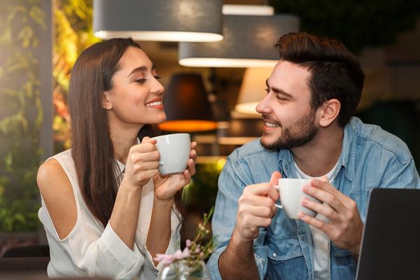 dating young couple tasting coffee drinks