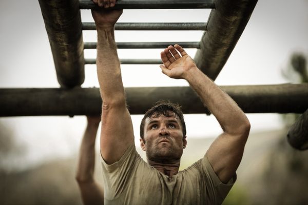 soldier climbing monkey bars boot camp
