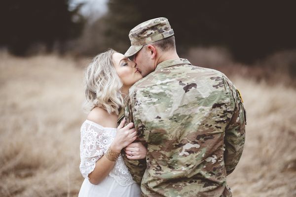 shallow focus shot american soldier kissing