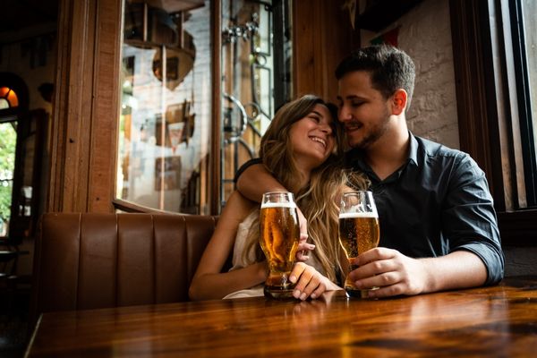 attractive young man woman couple love celebrating alcohol