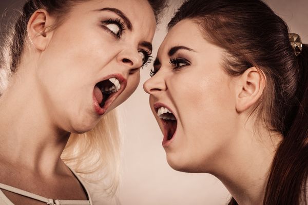 two aggressive women having argue fight