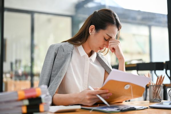 stressed millennial asian businesswoman feeling upset