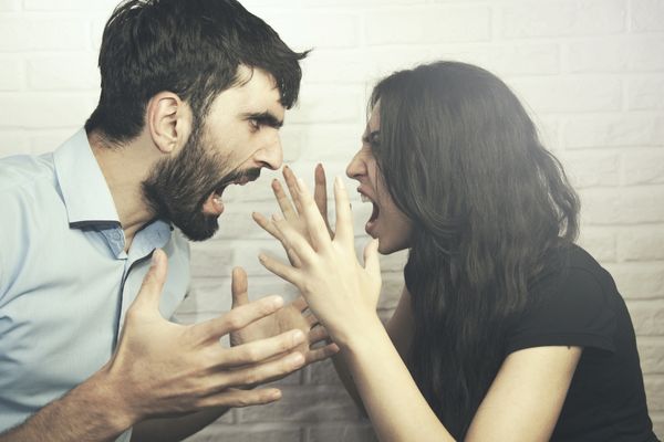 angry couple fighting shouting each other