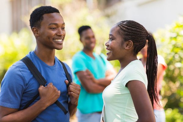 pretty african college girl talking with black man