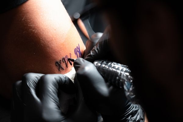 tattoo artist make roman numerals